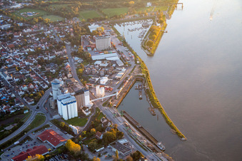 Quays and boat moorings at the port of the inland port of the Rhine river with Anker Memorial Gernsheim in Gernsheim in the state Hesse, Germany