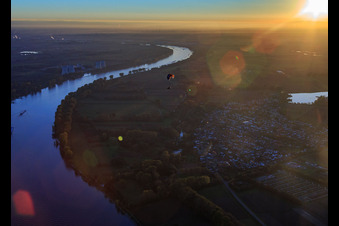 Course of the Rhine south to the Biblis nuclear power plant at sunset in Hamm am Rhein in the state Rhineland-Palatinate, Germany