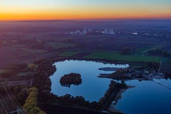 Aerial view of Nuclear power plant behind quarry lake in Groß-Rohrheim in the state Hesse, Germany