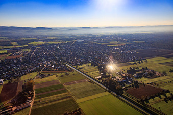 View of the village on the Weschnits from the west at sunrise in the district Kleinhausen in Einhausen in the state Hesse, Germany