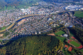 Oblique view of View of the town from both sides of the Murg river from the southwest in front of the Daimler Truck AG factory premises in Gaggenau in the state Baden-Wuerttemberg, Germany