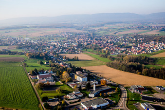 Aerial view of Village - view on the edge of agricultural fields and farmland in Soultz-sous-Forets in Grand Est, France