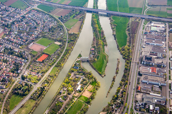 Island on the banks of the river course of Neckar in front of motorway bridge of the A6 in the district Feudenheim in Mannheim in the state Baden-Wurttemberg, Germany