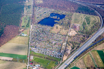 Village on the banks of lake Oberluecke in Viernheim in the state Hesse, Germany
