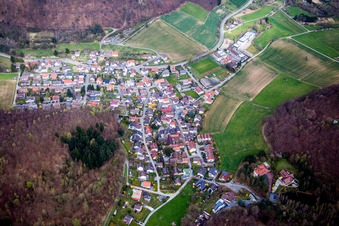 Aerial view of Village - view on the edge of agricultural fields and farmland in Waschenbach in the state Hesse, Germany
