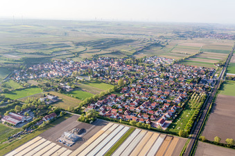 Village - view on the edge of agricultural fields and farmland in Mettenheim in the state Rhineland-Palatinate, Germany