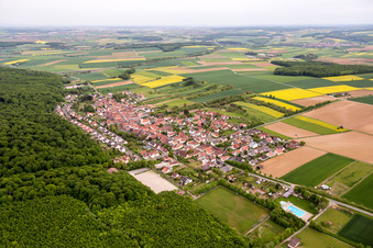 Village - view on the edge of agricultural fields and farmland in Schraudenbach in the state Bavaria, Germany