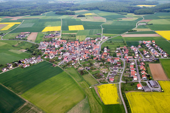 Aerial view of Village - view on the edge of agricultural fields and farmland in Ebertshausen in the state Bavaria