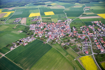 Aerial photograpy of Village - view on the edge of agricultural fields and farmland in Ebertshausen in the state Bavaria