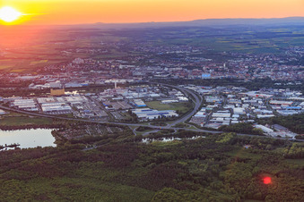 Industrial area HAFEN WEST and HAFEN OST behind the A70 at sunset in Schweinfurt in the state Bavaria, Germany