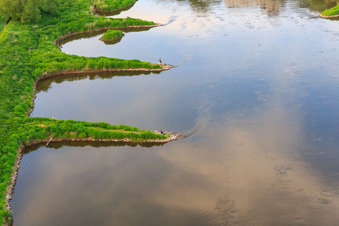Anglers on groynes on the Weser bank in the district Wehrden in Beverungen in the state North Rhine-Westphalia, Germany