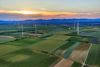 Hot air balloon between wind turbines in Offenbach an der Queich in the state Rhineland-Palatinate, Germany