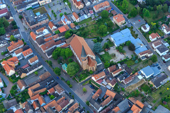 Oblique view of Church of St. Mary Assumption and Catholic Parish Hall of St. Mary Assumption in Herxheim bei Landau in the state Rhineland-Palatinate, Germany