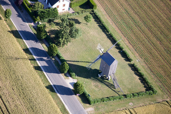 Historic windmill on a farm homestead on the edge of cultivated fields in Talcy in Centre-Val de Loire, France