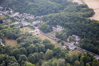Aerial view of Hot air balloon launch in front of Chateau de Perreux in Nazelles-Negron in Centre-Val de Loire, France