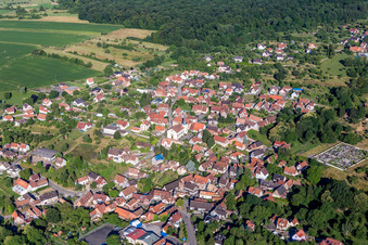 Aerial view of Village - view on the edge of agricultural fields and farmland in Lampertsloch in Grand Est, France
