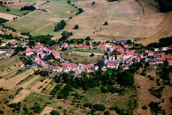 Village - view on a hill on the edge of agricultural fields and farmland in Amance in Grand Est, France