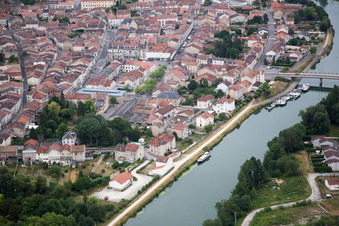 Aerial view of Village on the river bank areas der Meuse in Saint-Mihiel in Grand Est, France