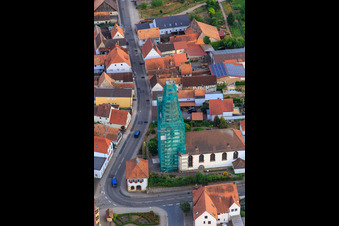 Bird's eye view of Catholic church scaffolded by Leidner GmbH Gerüstbau, Landau in Ottersheim bei Landau in the state Rhineland-Palatinate, Germany