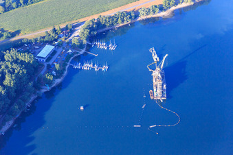 Floating dredger in the Wörth harbor with the RKC Wörth sailing club in the district Maximiliansau in Wörth am Rhein in the state Rhineland-Palatinate, Germany
