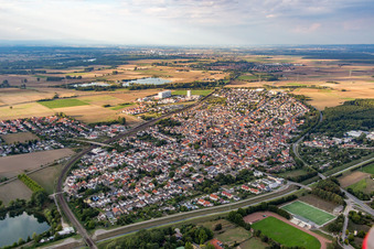 Oblique view of Town View of the streets and houses of the residential areas in Biblis in the state Hesse