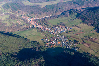 Aerial view of Village - view on the edge of agricultural fields and farmland in Rumbach in the state Rhineland-Palatinate, Germany