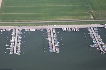 Aerial photograpy of Pleasure boat marina with docks and moorings on the shore area der Adria in Goro in Emilia-Romagna, Italy
