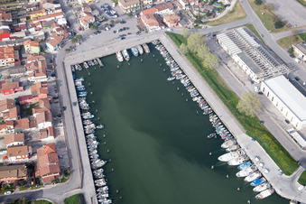 Pleasure boat marina with docks and moorings on the shore area der Adria in Goro in Emilia-Romagna, Italy from above