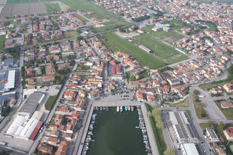Pleasure boat marina with docks and moorings on the shore area der Adria in Goro in Emilia-Romagna, Italy seen from above