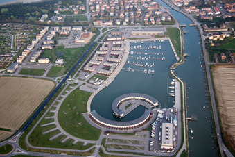 Oblique view of Pleasure boat marina with docks and moorings on the shore area Marina di Porto Reno in Casalborsetti in Emilia-Romagna, Italy