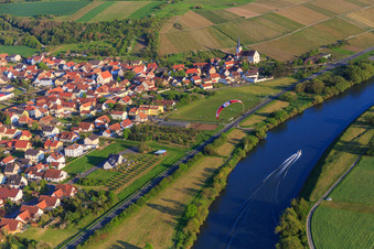 Village view on the banks of the Main from the north with St. Bartholomew in the district Stammheim in Kolitzheim in the state Bavaria, Germany