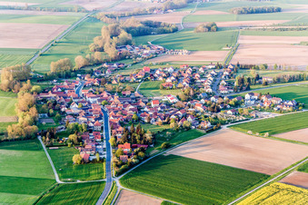 Village - view on the edge of agricultural fields and farmland in Reupelsdorf in the state Bavaria, Germany