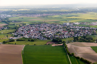 Village - view on the edge of agricultural fields and farmland in Wolfskehlen in the state Hesse, Germany