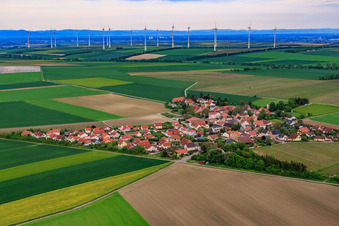 Village view from the west in front of the wind farm in Frettenheim in the state Rhineland-Palatinate, Germany