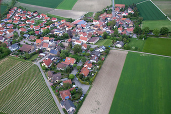Aerial view of Village - view on the edge of agricultural fields and farmland in Frettenheim in the state Rhineland-Palatinate, Germany