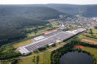 Aerial view of Building and production halls on the premises of Rauch Moebelwerke GmbH in Freudenberg in the state Baden-Wurttemberg, Germany