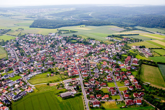 Village - view on the edge of agricultural fields and farmland in Waldbrunn in the state Bavaria, Germany