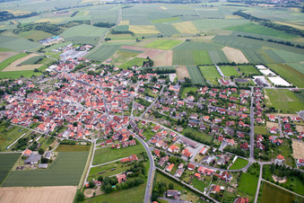 Aerial view of Village - view on the edge of agricultural fields and farmland in Grossbardorf in the state Bavaria, Germany