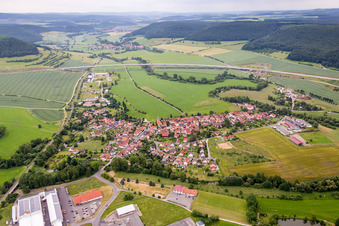 Village - view on the edge of agricultural fields and farmland in Einhausen in the state Thuringia, Germany