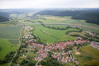 Aerial view of Village - view on the edge of agricultural fields and farmland in Einhausen in the state Thuringia, Germany