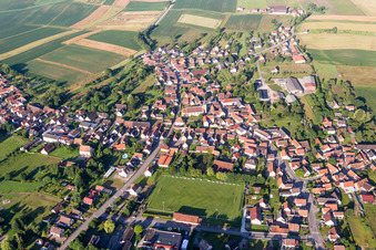 Aerial view of Village - view on the edge of agricultural fields and farmland in Riedseltz in Grand Est, France