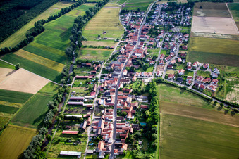 Village - view on the edge of agricultural fields and farmland in Herxheimweyher in the state Rhineland-Palatinate, Germany