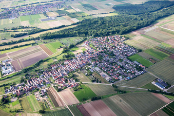 Village - view on the edge of agricultural fields and farmland in Freisbach in the state Rhineland-Palatinate, Germany