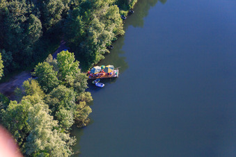 Summer picnic on a raft on the Isar in the district Harburg in Pilsting in the state Bavaria, Germany