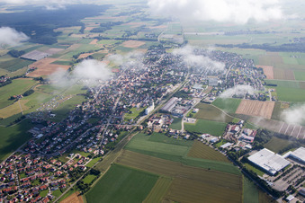 Oblique view of Town View of the streets and houses below clouds of the residential areas in Geiselhoering in the state Bavaria