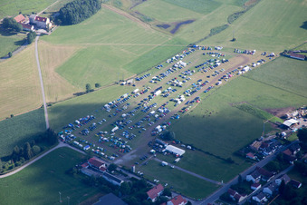 Camping with caravans and tents on a field in Geiselhoering in the state Bavaria