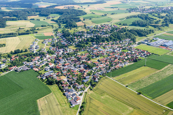 Village - view on the edge of agricultural fields and farmland in Moosthenning in the state Bavaria, Germany