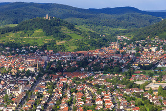 Mozartstraße with St. Peter's Church on the edge of the Odenwald from the west below the vineyards and the Starkenburg in Heppenheim in the state Hesse, Germany