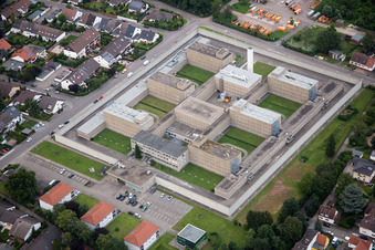 Surrounded by security fence premises of jail Justizvollzugsanstalt Frankenthal in Frankenthal (Pfalz) in the state Rhineland-Palatinate, Germany