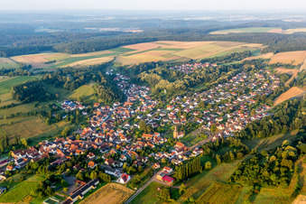 Aerial view of Village - view on the edge of agricultural fields and farmland in Sippersfeld in the state Rhineland-Palatinate, Germany